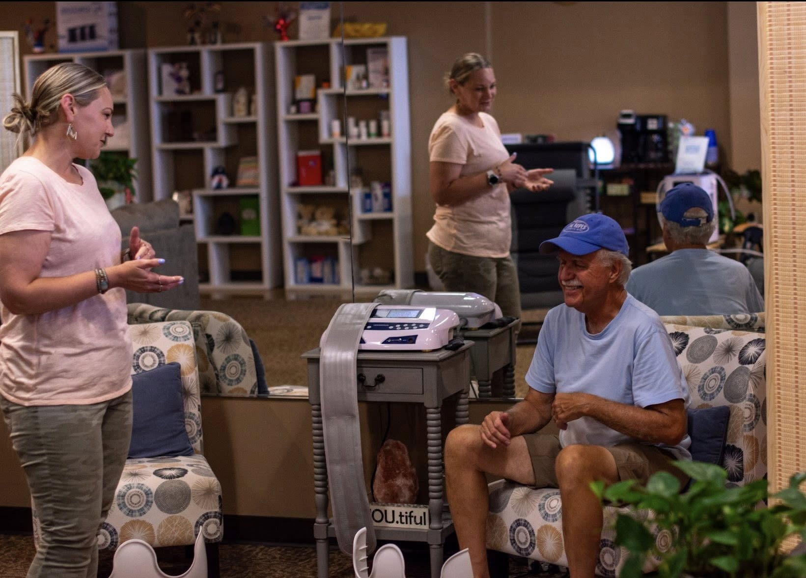 Guests chatting with staff in the relaxation lounge